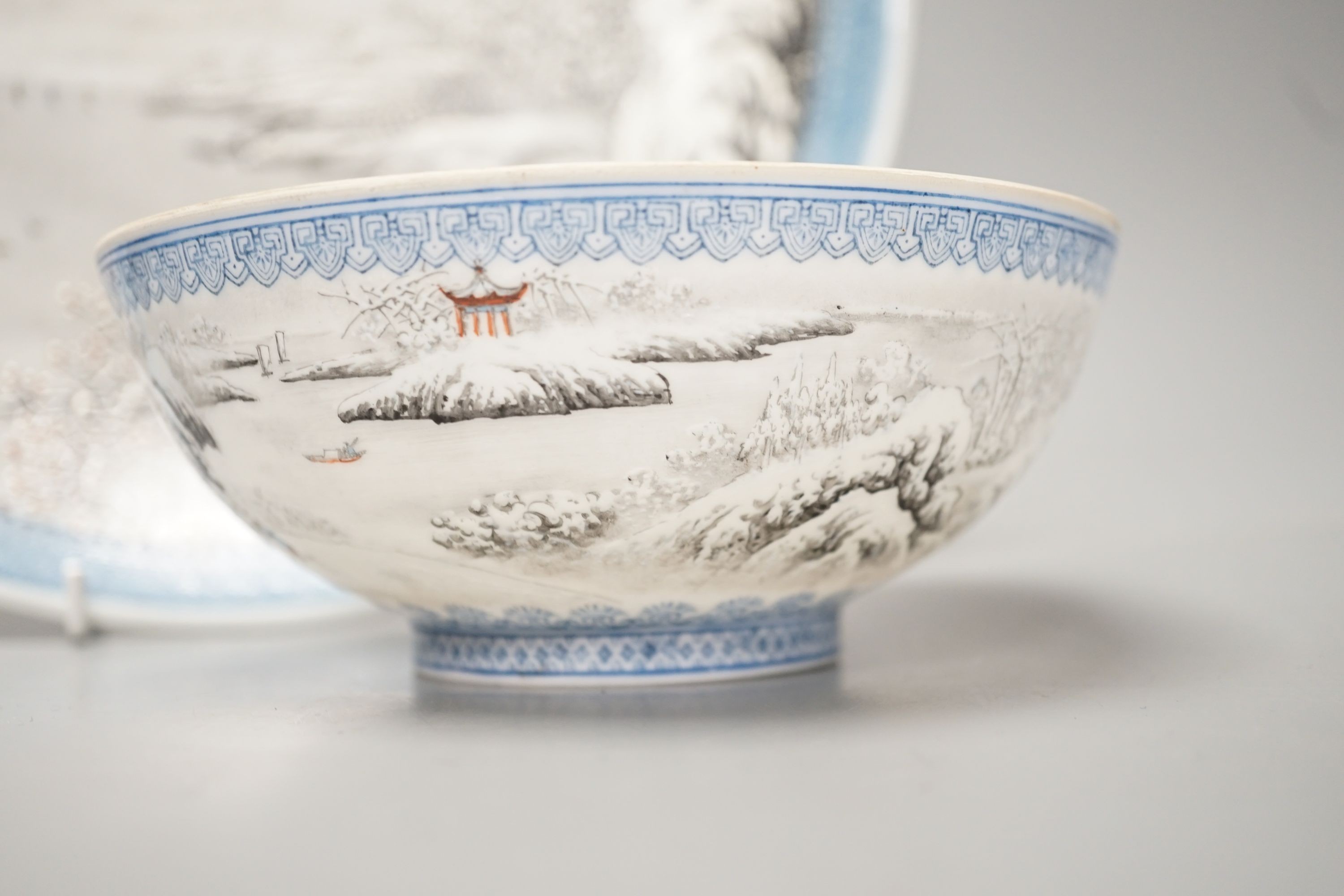 A Chinese enamelled porcelain snow scene dish, diameter 31cm, and a similar smaller eggshell bowl